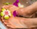 person's feet with flowers