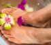person's feet with flowers